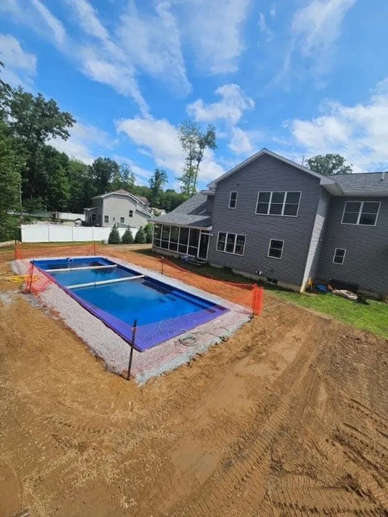 Fiberglass pool with decking in the Capital Region — pool installation near Queensbury, NY