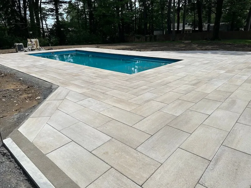 Backyard fiberglass pool and patio in the Capital Region — pool installation near Cambridge, NY