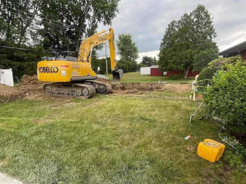 Custom fiberglass pool and hardscape installation — pool installation near Queensbury, NY