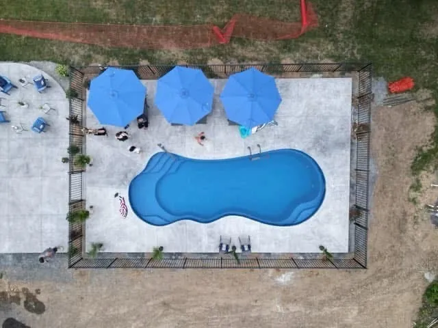 drone view of new pool installation in Guilderland